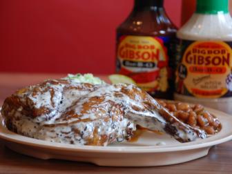 Big Bob Gibson Bar-B-Q signature dishes Pulled Pork, Smoked Chicken with White Sauce, St. Louis Style Ribs, and award-winning pies like Coconut Cream and Chocolate.